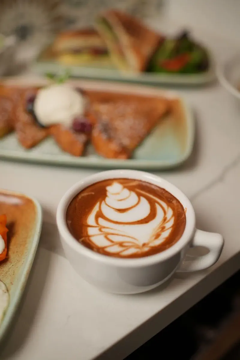 Latte Art Warmth at Concha's Café